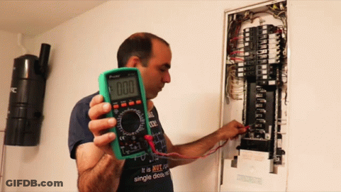 Man Holding Multimeter Saying 000 GIF