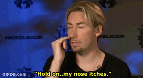 Man Holding Nose In Front Of Nickelback Logo GIF