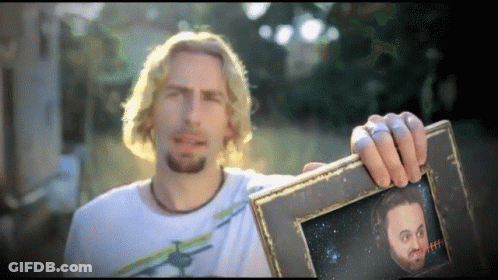 Man Holding Open-Mouthed Picture GIF
