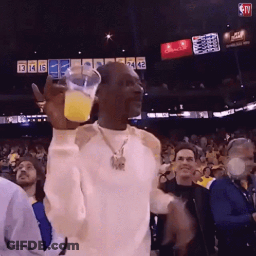 Man Holding Orange Juice At Oracle Basketball Game GIF