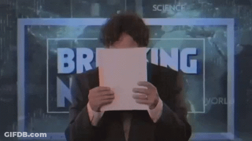 Man Holding Paper In Front Of Breaking News Sign GIF