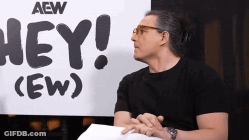 Man Holding Paper In Front Of Hey Sign GIF