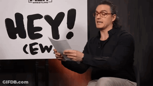 Man Holding Paper In Front Of Hey Sign GIF
