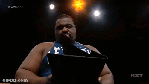 Man Holding Paper In Front Of Screen #Wwenext GIF