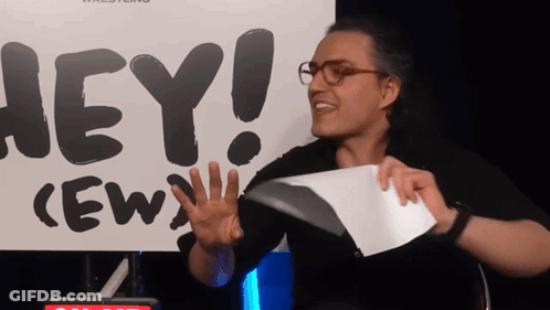 Man Holding Paper In Front Of Sign Saying Hey GIF