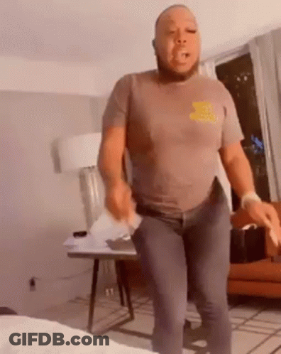 Man Holding Paper In Pocket GIF