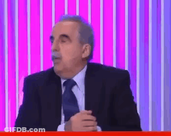 Man Holding Paper Looking At It GIF