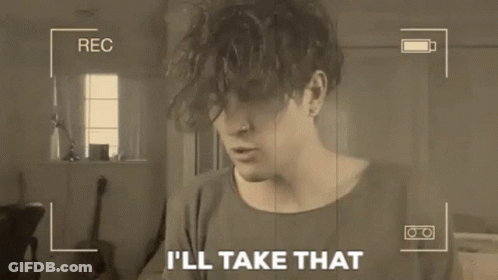 Man Holding Paper Saying I'll Take That On Camera GIF