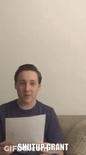 Man Holding Paper Saying Shutup Grant GIF
