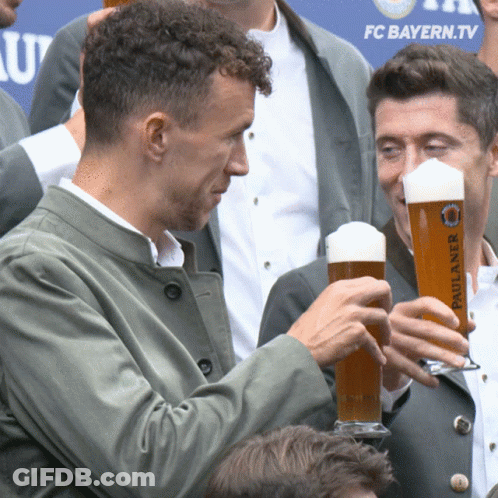Man Holding Paulaner Beer At FC Bayern.tv Sign GIF