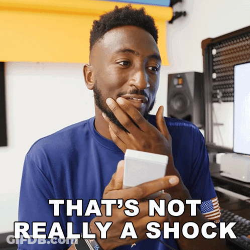 Man Holding Phone Saying That's Not Really Shock GIF