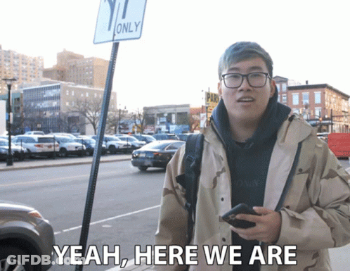 Man Holding Phone Saying Yeah Here We Are GIF