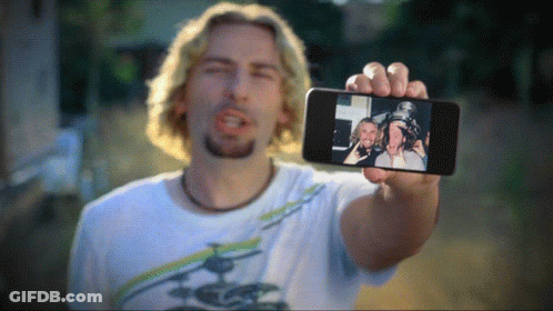 Man Holding Phone With Two Men GIF