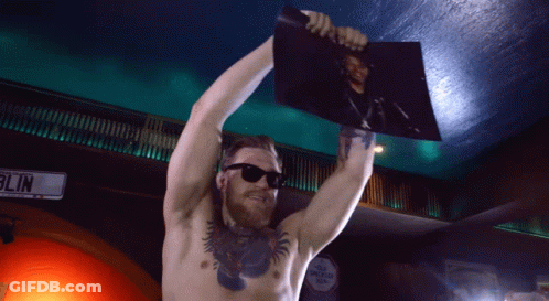 Man Holding Picture In Front Of Blin Sign GIF