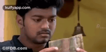 Man Holding Pile Of Money GIF