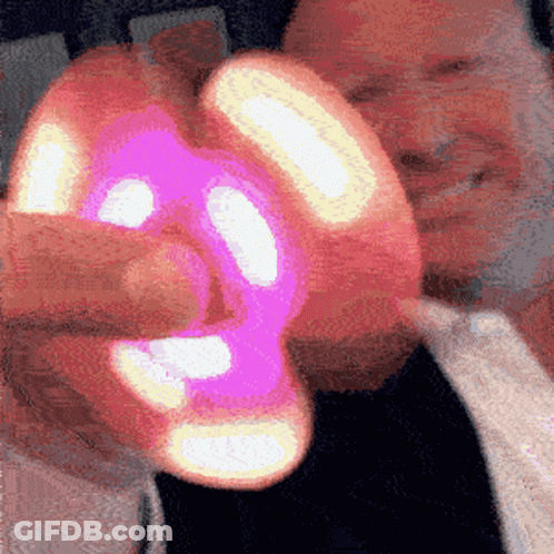 Man Holding Pink And Yellow Object GIF
