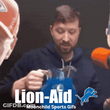 Man Holding Pitcher With Detroit Lions Logo GIF
