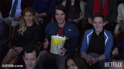 Man Holding Popcorn Bucket Netflix GIF
