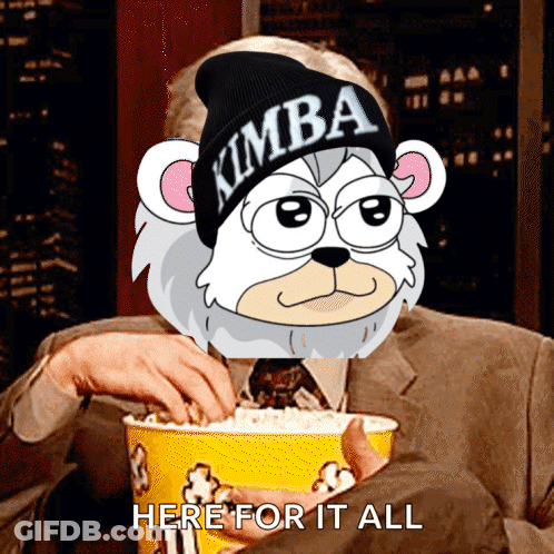 Man Holding Popcorn With Cartoon Character In Kimba Hat GIF