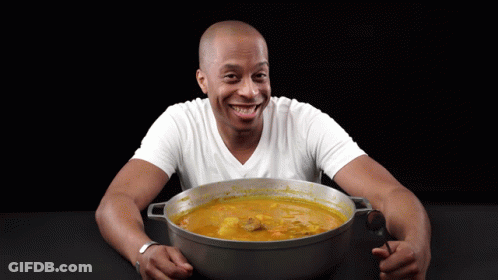 Man Holding Pot Of Soup Smiling GIF