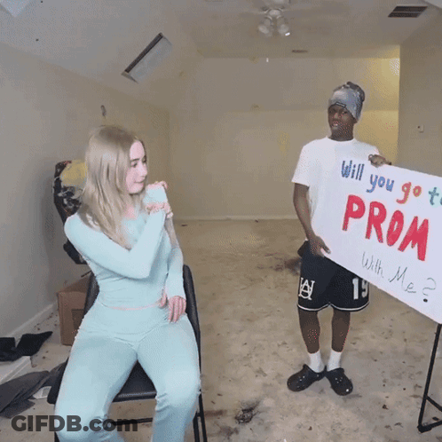 Man Holding Promposal Sign GIF