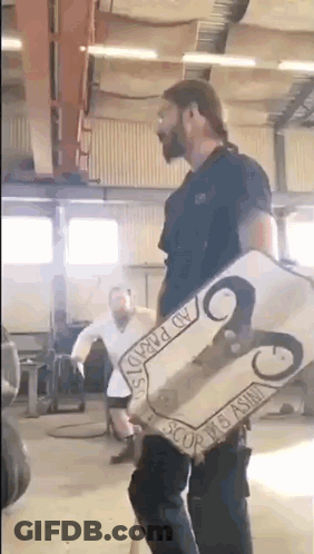 Man Holding Ram Shield GIF
