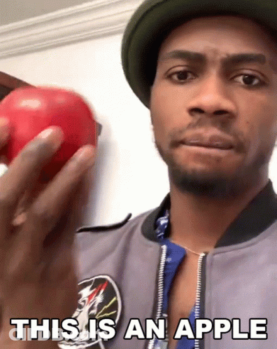 Man Holding Red Apple Saying This Is An Apple GIF