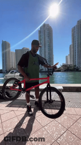 Man Holding Red BMX Bike GIF