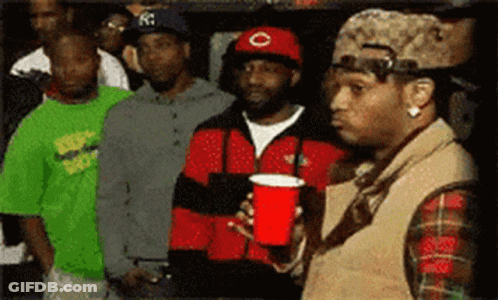 Man Holding Red Cup In Crowd GIF