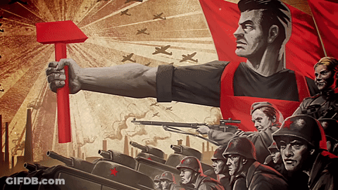 Man Holding Red Hammer Surrounded By Soldiers GIF