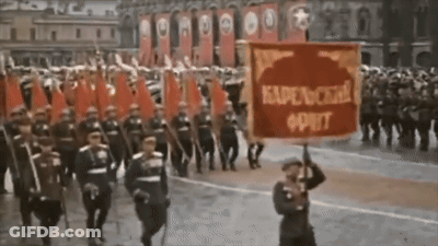 Man Holding Red Kapenckha Oprit Banner GIF