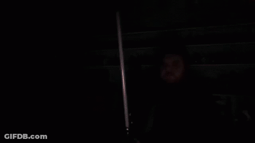 Man Holding Red Lightsaber GIF