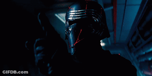 Man Holding Red Lightsaber With AT-ATs GIF