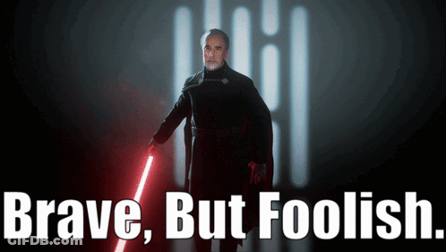 Man Holding Red Lightsaber With Brave But Foolish GIF