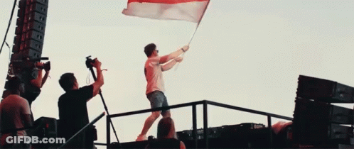 Man Holding Red White Blue Flag GIF