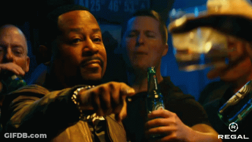 Man Holding Regal Beer Pointing GIF