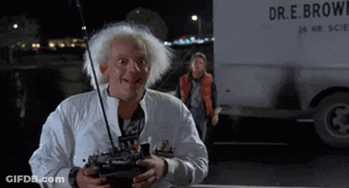 Man Holding Remote In Front Of Truck Saying Dr.E. Brown GIF