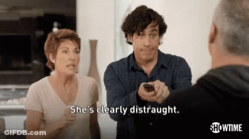 Man Holding Remote Woman Distraught GIF