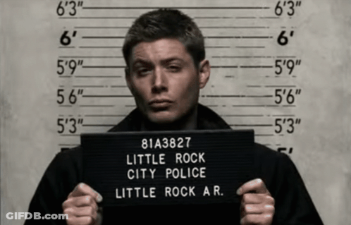 Man Holding Rock City Police Mugshot GIF