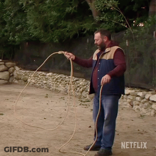 Man Holding Rope With Netflix Logo GIF