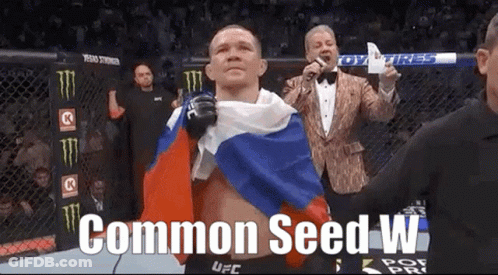 Man Holding Russian Flag In Boxing Ring Saying Common Seed W GIF