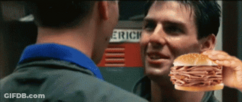 Man Holding Sandwich In Front Of Eric Sign GIF