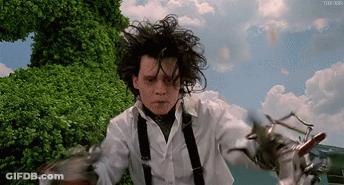 Man Holding Scissors GIF