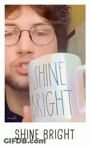 Man Holding Shine Bright Mug GIF