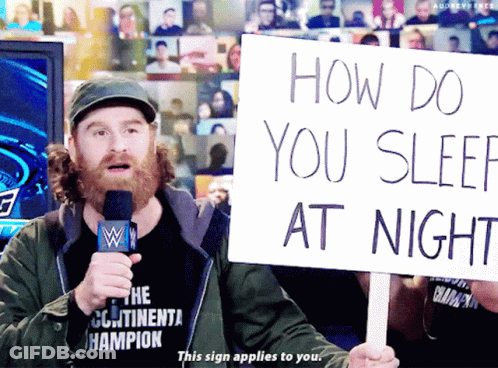 Man Holding Sign How Do You Sleep At Night GIF