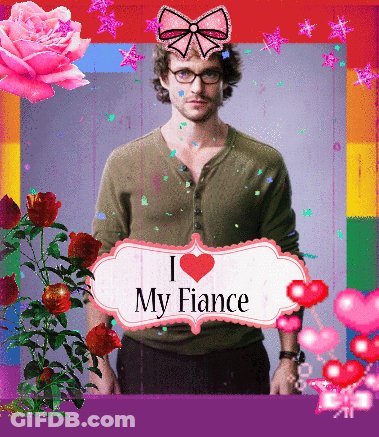 Man Holding Sign I Heart My Fiance GIF
