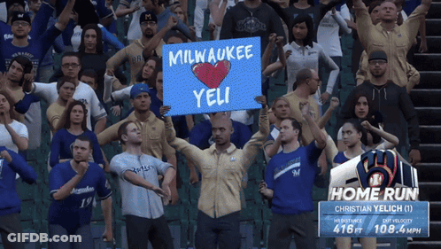 Man Holding Sign Milwaukee Yeli GIF