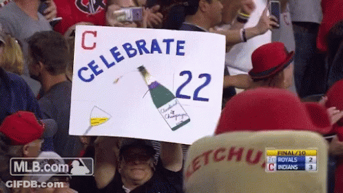 Man Holding Sign Saying Celebrate 22 GIF