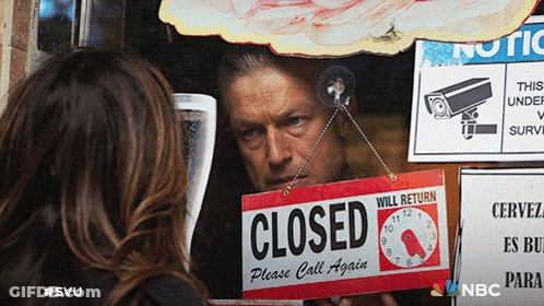 Man Holding Sign Saying Closed GIF