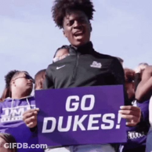 Man Holding Sign Saying Go Dukes GIF